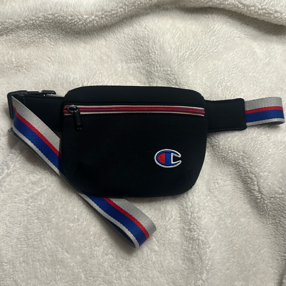 I am selling a black, red, and blue Champion fanny pack.